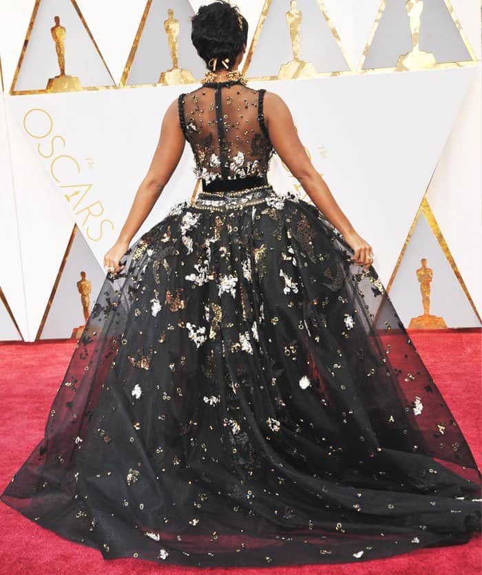 Janelle Monáe Robinson shows off the back view of her gorgeous Elie Saab dress