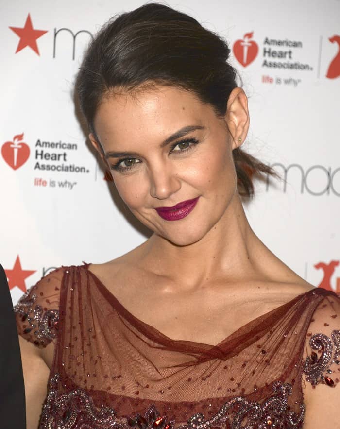 Katie Holmes' radiant smile was perfectly complemented by her bold berry lipstick