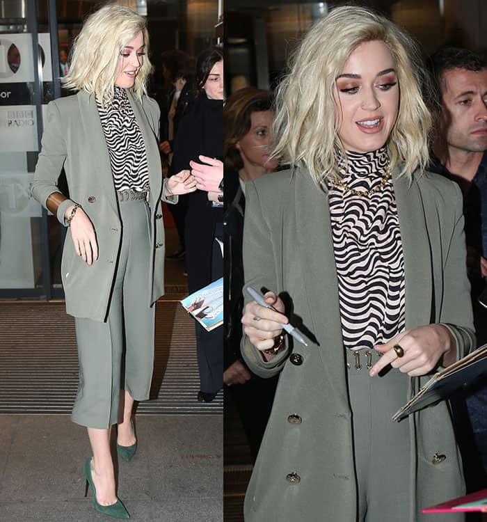 Katy Perry wearing an Elisabetta Franchi blazer and culottes, a Vanessa Seward turtleneck top, and green suede pumps