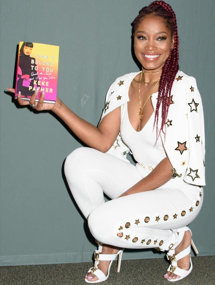 Keke Palmer poses with her book "I Don't Belong to You: Quiet the Noise and Find Your Voice"