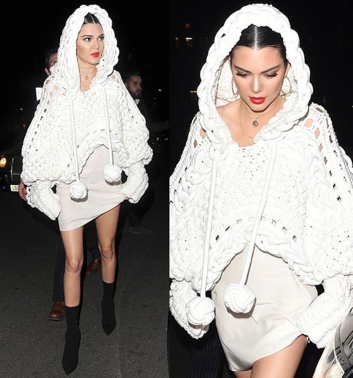 Kendall Jenner looked absolutely fabulous in a sleek slip dress paired with edgy ankle boots and a breathtaking couture cape