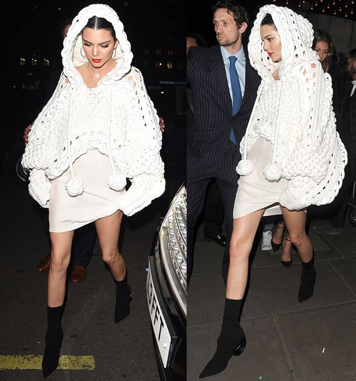 Kendall Jenner opted for a statement cream cape adorned with pom pom detailing straight from Burberry's runway earlier that evening