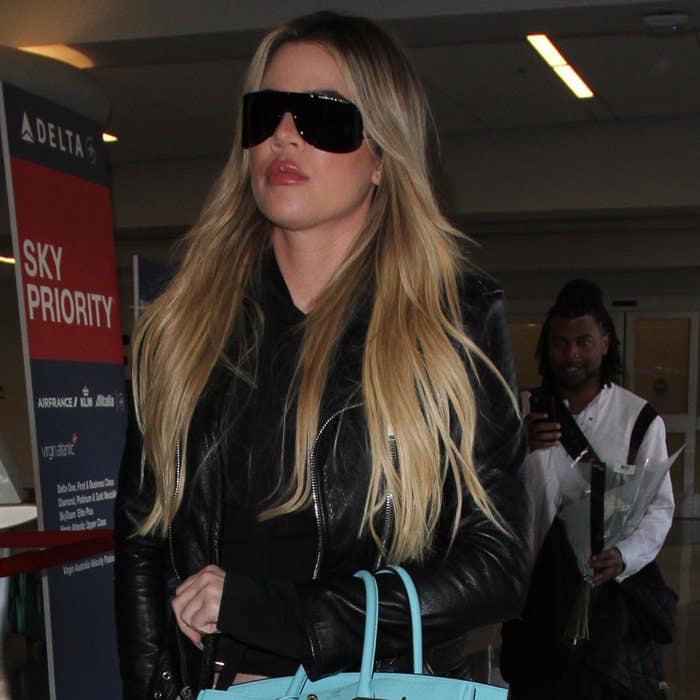 Khloé Kardashian, known for her frequent travels, emphasizes the importance of staying hydrated and moisturized, even on long flights