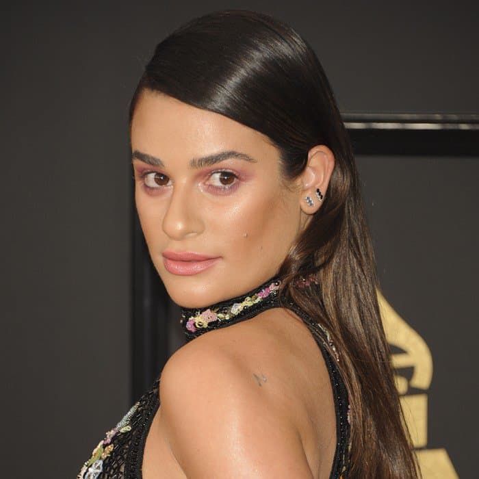 Lea Michele’s striking brown eyes are accentuated by rose-gold smoky makeup