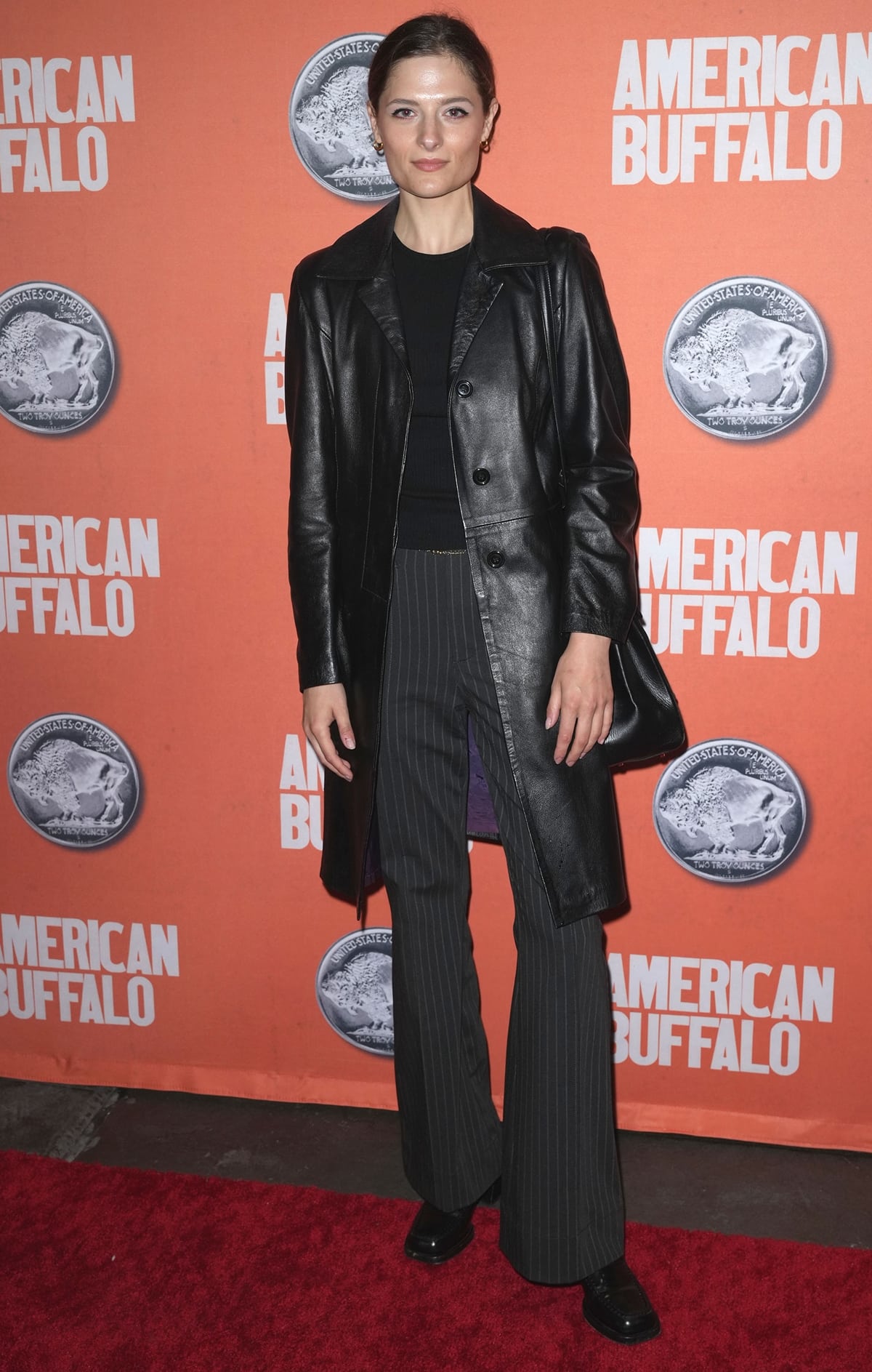 Louisa Jacobson poses in a leather coat at the opening night of "American Buffalo"