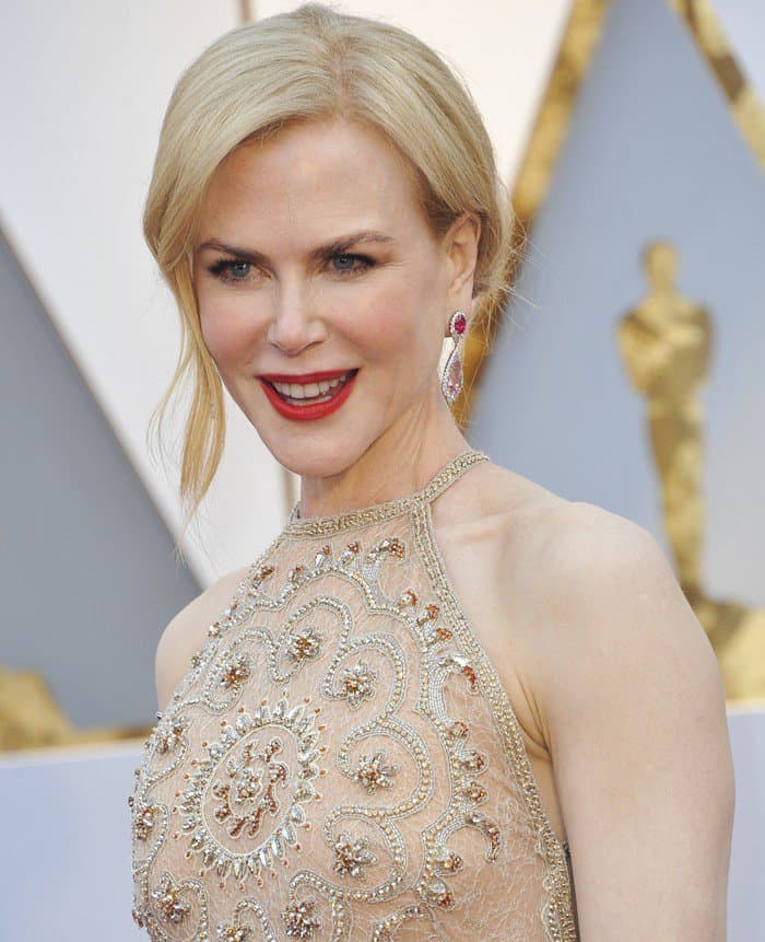 Nicole Kidman's nude Armani Privè gown features intricate embroidery with dazzling beaded embellishments, creating a stunning mandala-inspired design