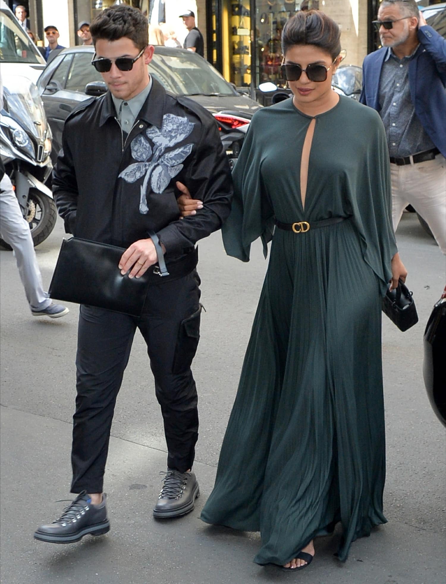 Priyanka Chopra in a forest green maxi dress and her husband Nick Jonas attend the Christian Dior Haute Couture Fall/Winter 2019 2020 show