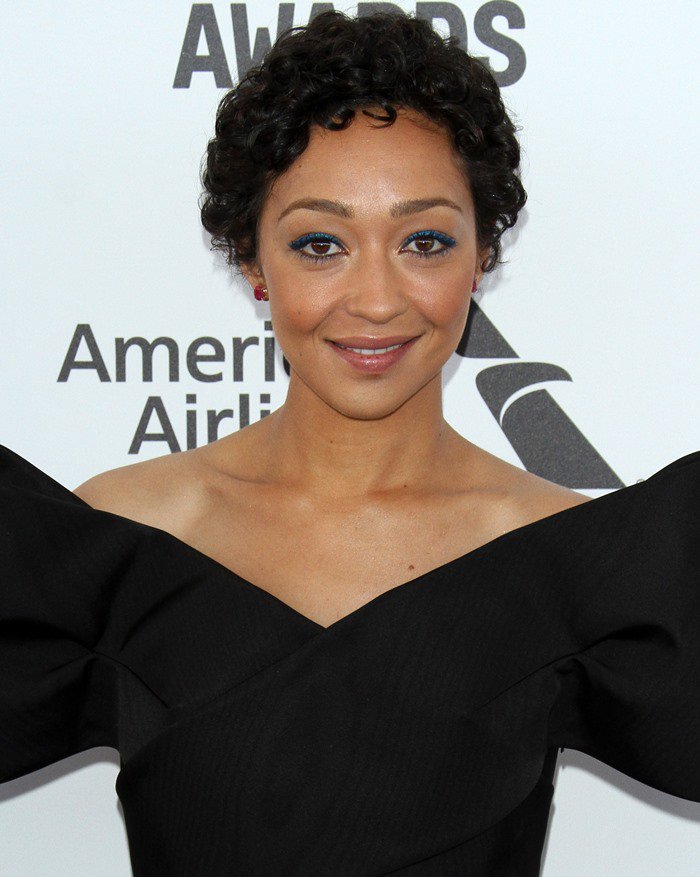 Ruth Negga pairs her Delpozo off-the-shoulder bow dress with bold blue eyeliner and soft pink lips