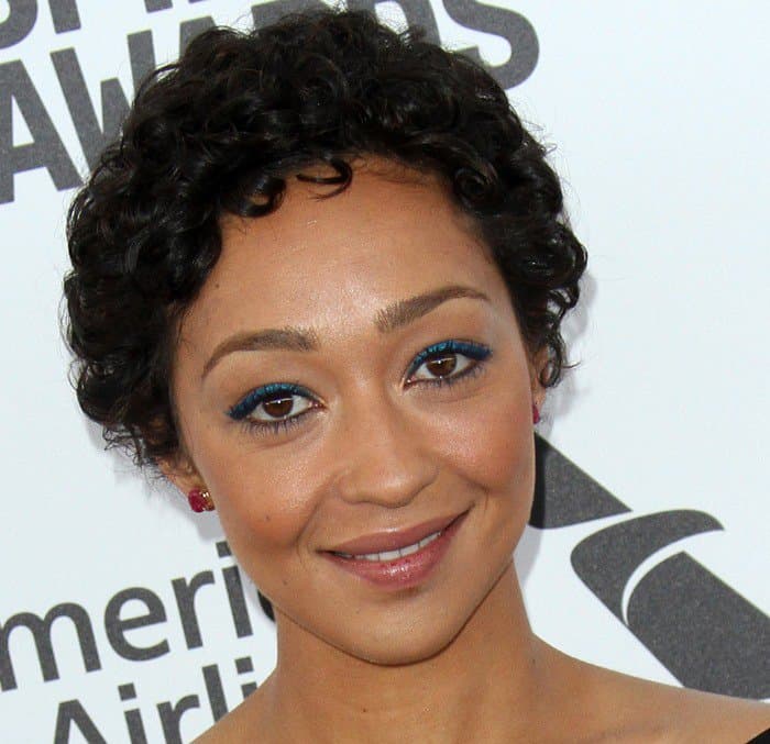 Ruth Negga showcases her natural beauty with a short, curly hairstyle