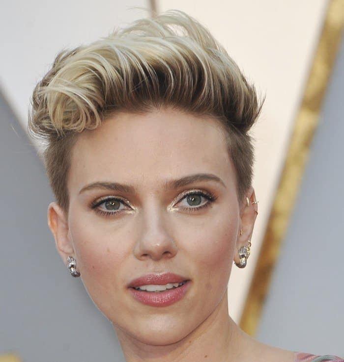 Scarlett Johansson rocked an edgy platinum blonde cropped hairstyle, adding a modern twist to her elegant red carpet look