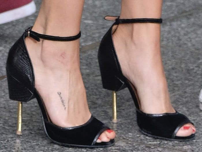 Closeup of Givenchy "Matilda" ankle-strap sandals on Selena Gomez