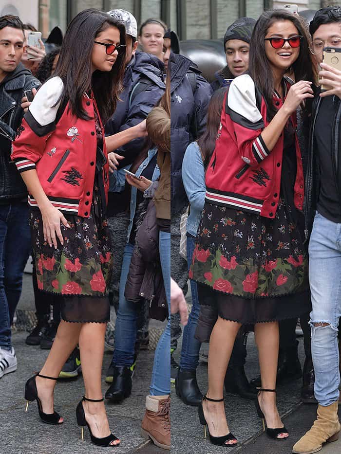 Selena Gomez posing for pictures with fans outside her New York City hotel on February 8, 2017