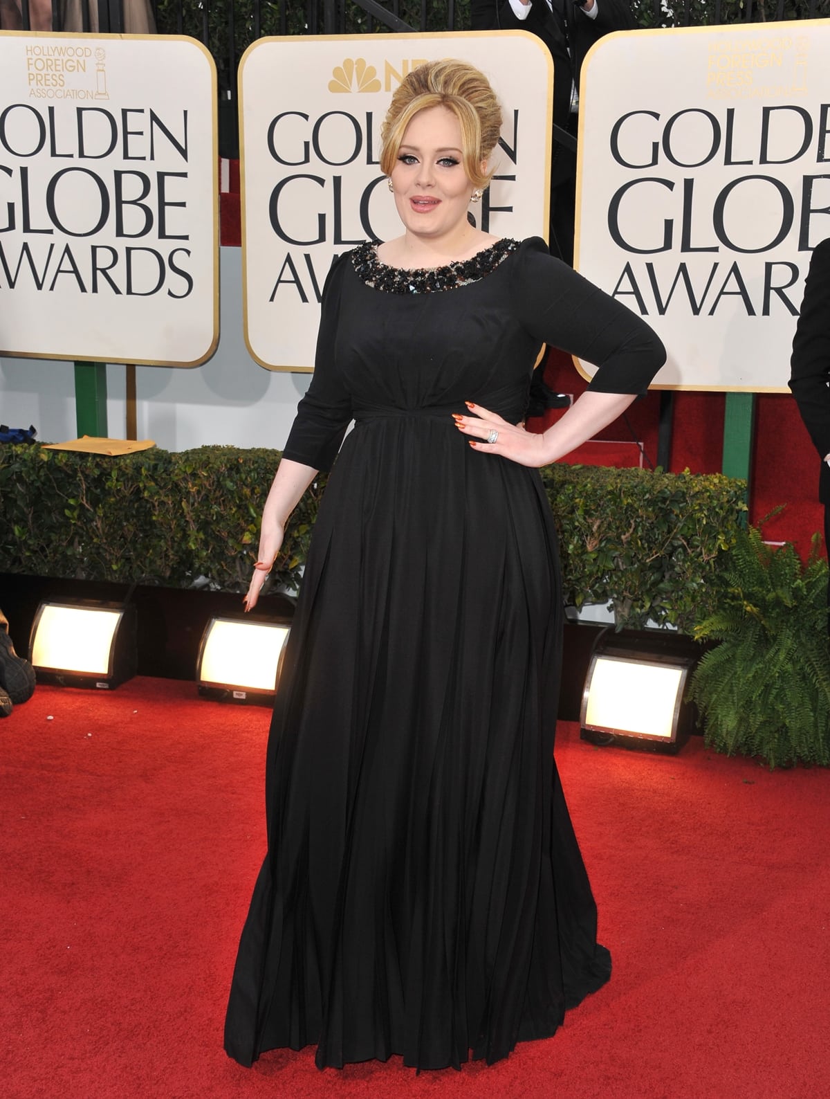 Singer Adele in a black Burberry dress with Cartier jewelry at the 70th Annual Golden Globe Awards