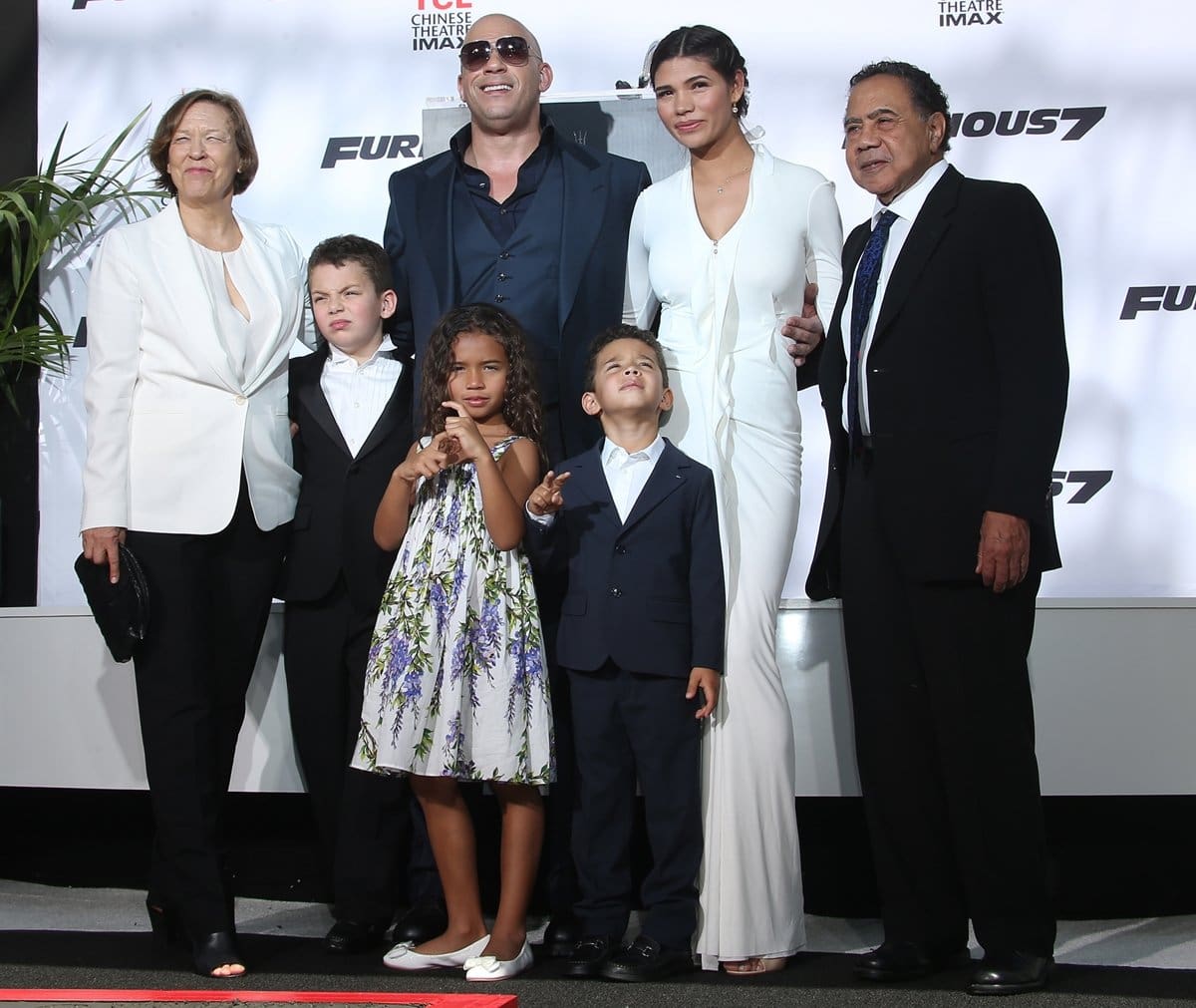 Vin Diesel with his mother, astrologer Delora Sherleen Vincent (née Sinclair), his adoptive African-American father, Irving H. Vincent, his girlfriend, Mexican model Paloma Jimenez, his daughter Hania "Similce" Riley, his son Vincent Sinclair, and a guest