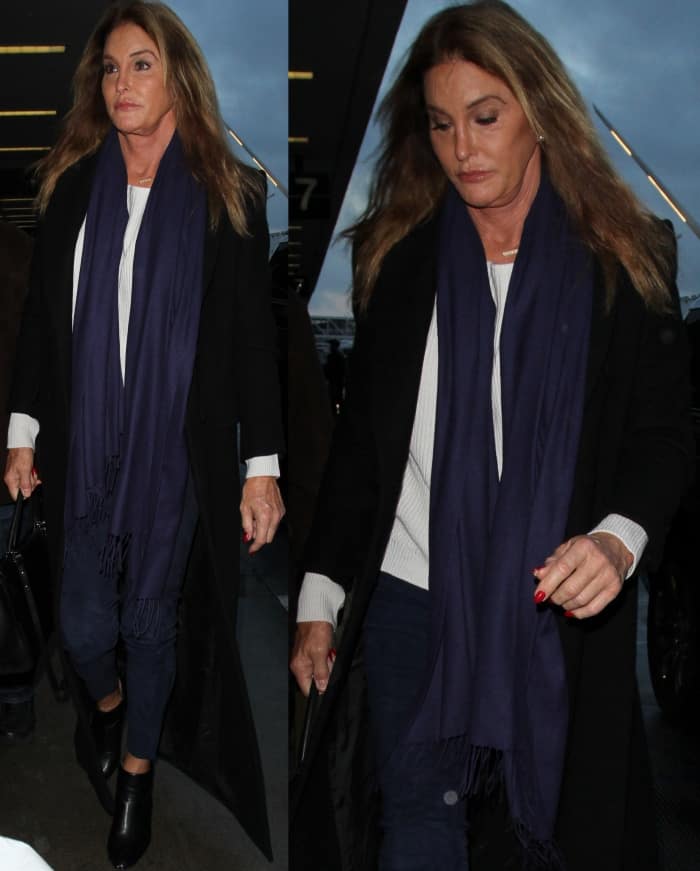 Caitlyn Jenner kept her travel look sleek and sophisticated at LAX, pairing black leather ankle boots with a navy scarf and a chic black coat for an effortlessly polished outfit