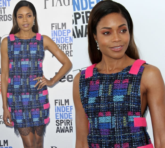 Naomie Harris radiates sophistication in a textured multicolored Chanel dress featuring bold hot pink straps and intricate black lace trim