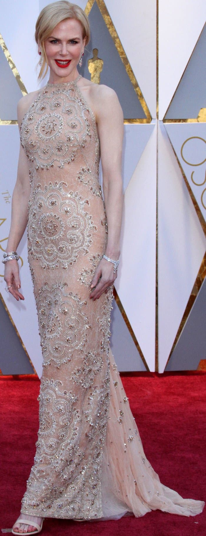 Nicole Kidman completed her look with diamond-encrusted bracelets for added sparkle and opted for nude pedicure sandals that seamlessly complemented her gown
