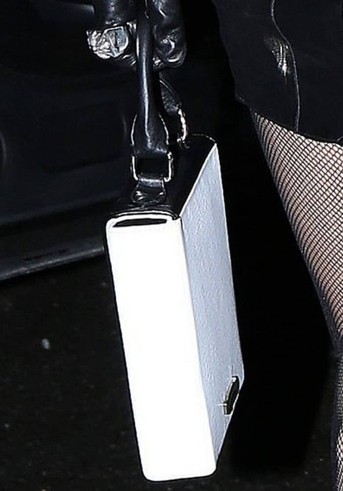 Bella pairs her leather dress with a somewhat preppy square bag