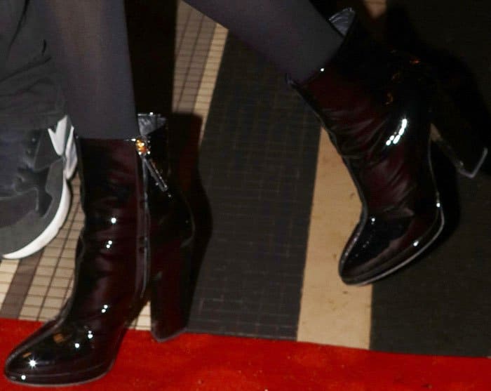 Bella looked chic in a pair of Giuseppe Zanotti patent boots