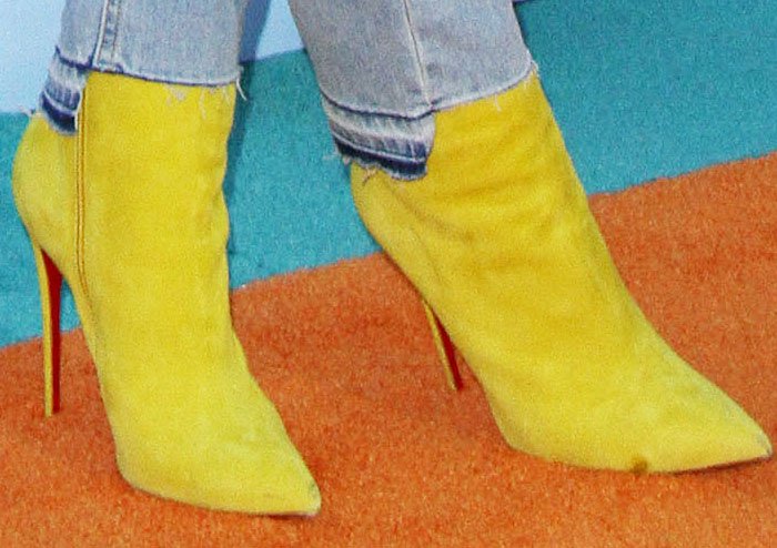 Blac Chyna added a pop of color to her outfit with yellow Christian Louboutin So Kate boots