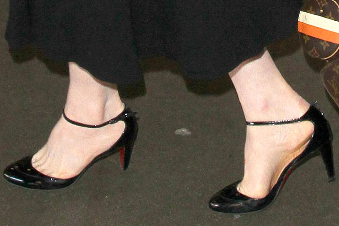 Dita Von Teese's feet in Christian Louboutin ankle-strap pumps with low heels