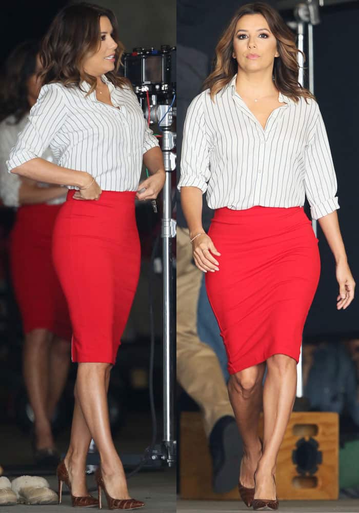 Eva shows off her curvaceous silhouette in a striped top and Victoria Beckham pencil skirt