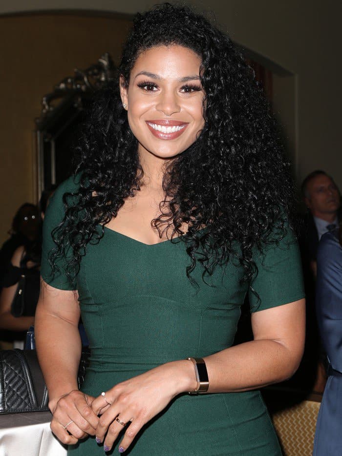 Jordin Sparks radiates charm and elegance in a flattering emerald ensemble, her smile as captivating as her music