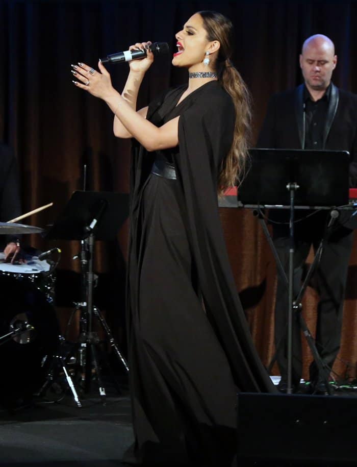 Pia Toscano channels her inner diva, giving a powerful performance in a dramatic black cape gown