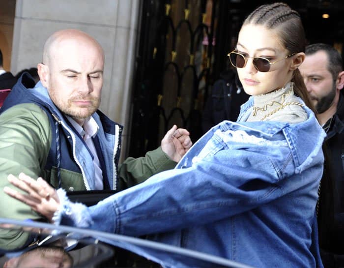 Gigi emerges from the Balmain show before rushing off to the Isabel Marant one