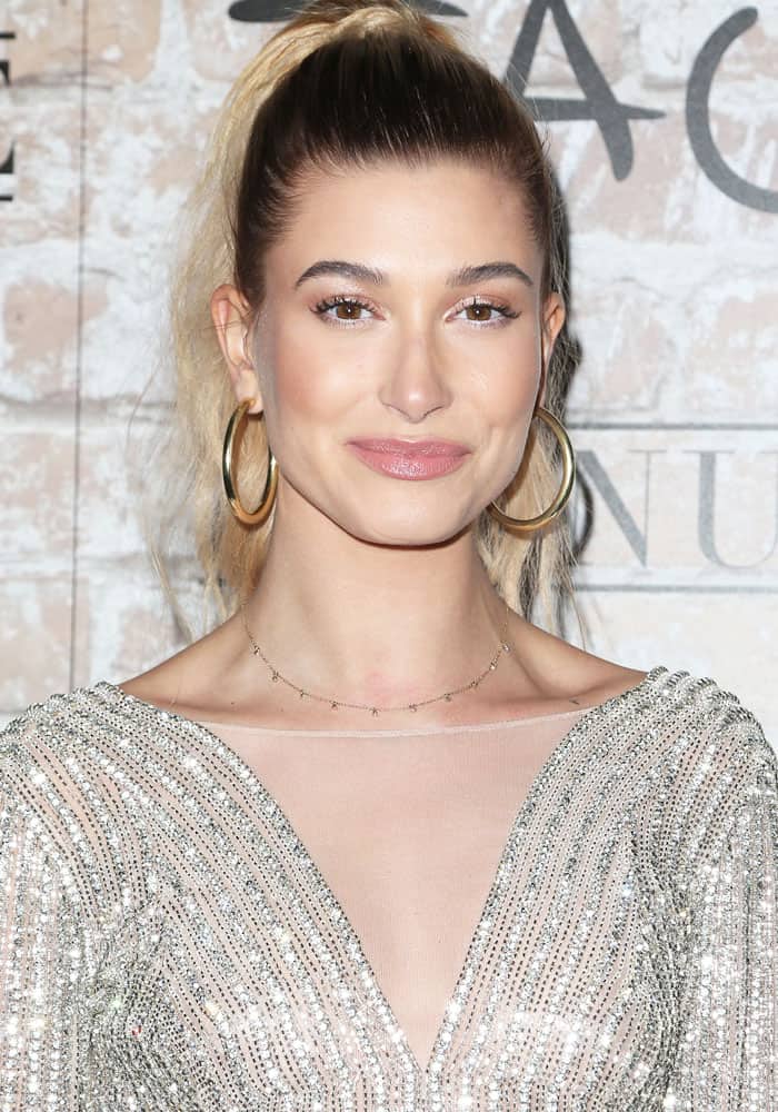 Hailey Baldwin surprised everyone with a sparkling look at the TAO, Beauty & Essex, Avenue, and Luchini grand opening