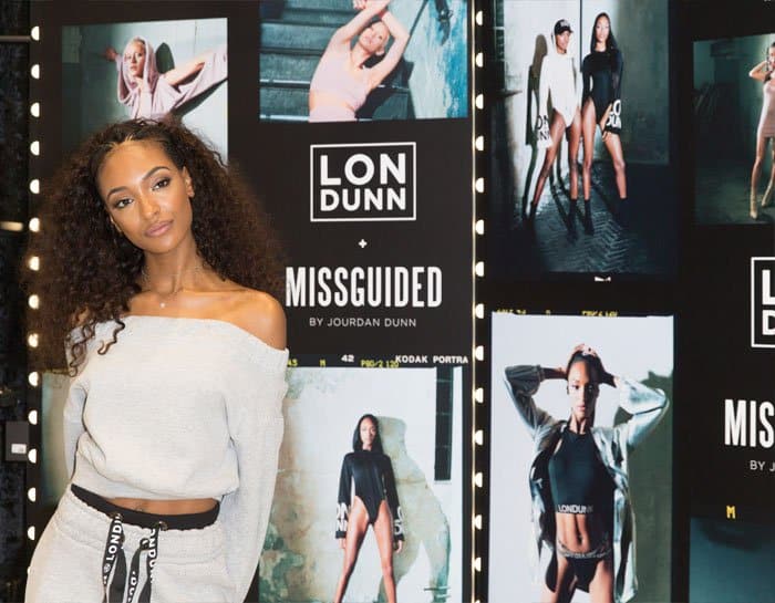 Jourdan Dunn poses alongside her Londunn x Missguided campaign posters