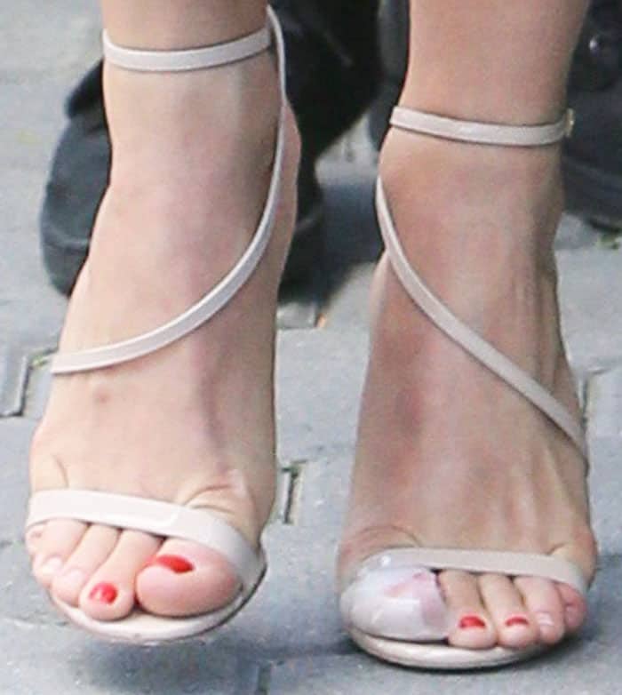 Julianne dons the sexy and strappy Alexander White "Hara" sandals