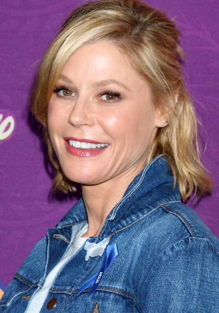 Julie Bowen radiates effortless beauty at the screening of Disney's Tangled Before Ever After in Los Angeles on March 4, 2017, with her tousled blonde waves, subtle smokey eye, and glossy pink lips enhancing her fresh and youthful glow