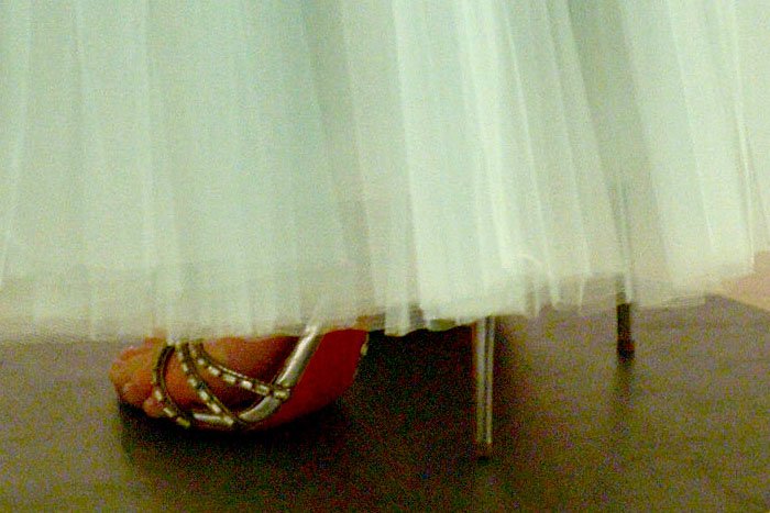 Christian Louboutin's "Girlfriend" sandals peeking out from the hem of Kate Bosworth's J. Mendel gown