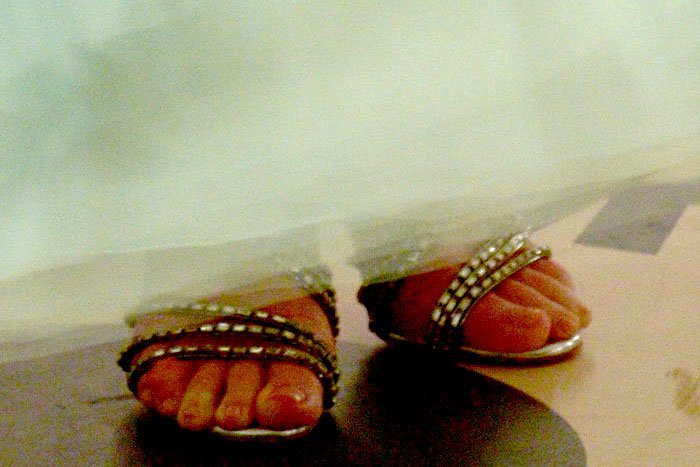 Christian Louboutin's "Girlfriend" sandals peeking out from the hem of Kate Bosworth's J. Mendel gown