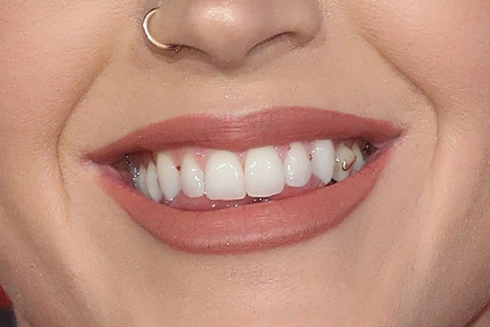 Katy Perry's gold Nike Swoosh teeth jewelry