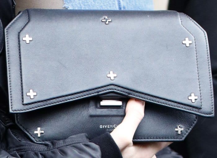 Kendall Jenner flaunts her edgy Givenchy Bow Cut Clutch, detailed with sleek silver cross embellishments