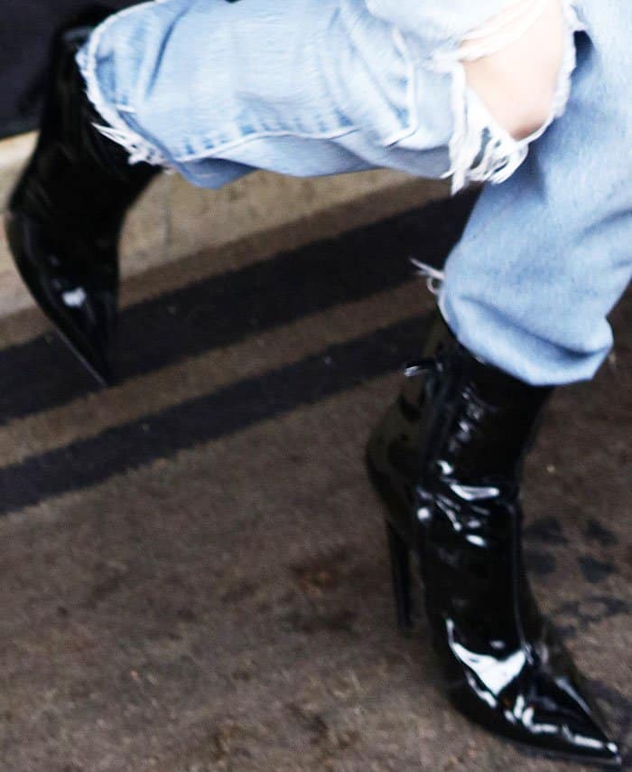Kendall Jenner steps out in style wearing sleek pointed-toe patent leather boots