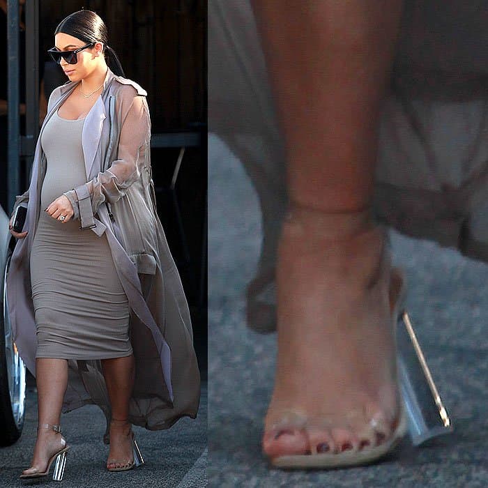 Pregnant Kim Kardashian in Yeezy clear sandals that look like they're about to snap