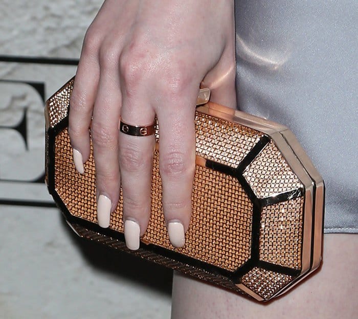 Madelaine Petsch toted a glittering metallic clutch