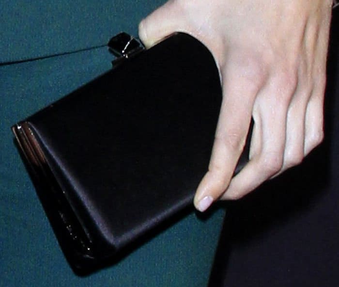 Mandy Moore kept her styling simple with a satin rectangular clutch