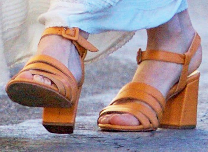 Nikki Reed's sexy feet in strappy chunky-heeled sandals