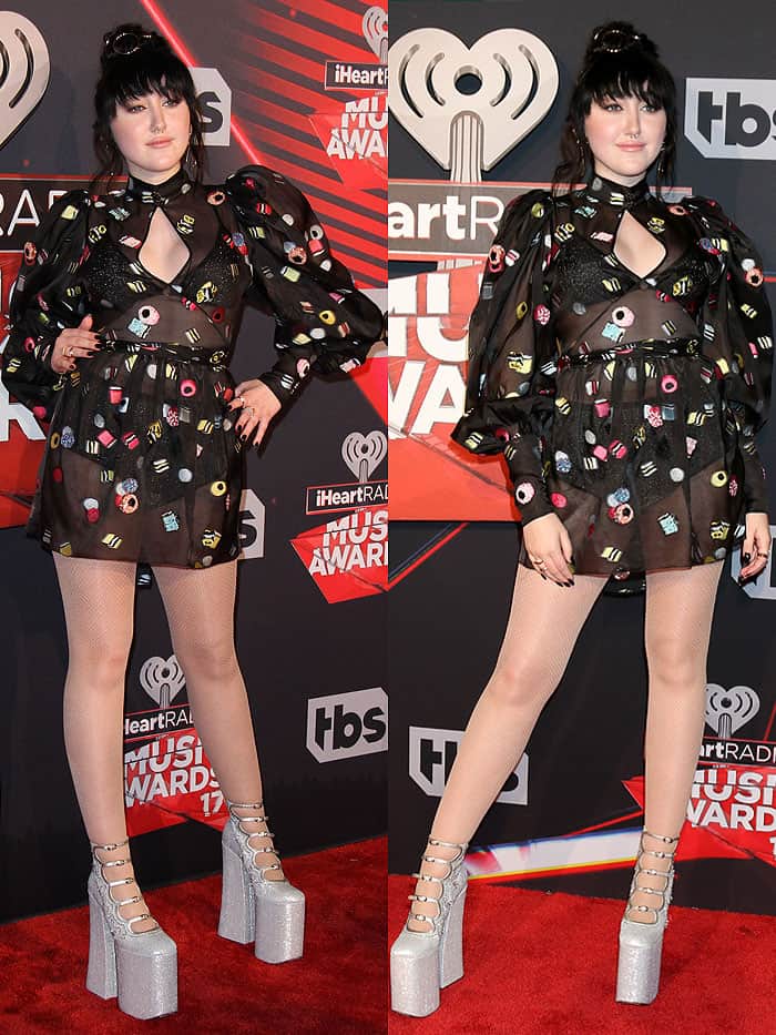 Noah Cyrus's sheer dress revealed a metallic bralette and high-waisted briefs underneath, while her gravity-defying silver glitter platform heels added a daring touch