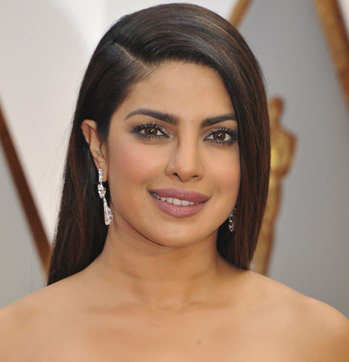 Priyanka Chopra straightened her long, dark hair, and rocked glittery eye makeup and mauve lips