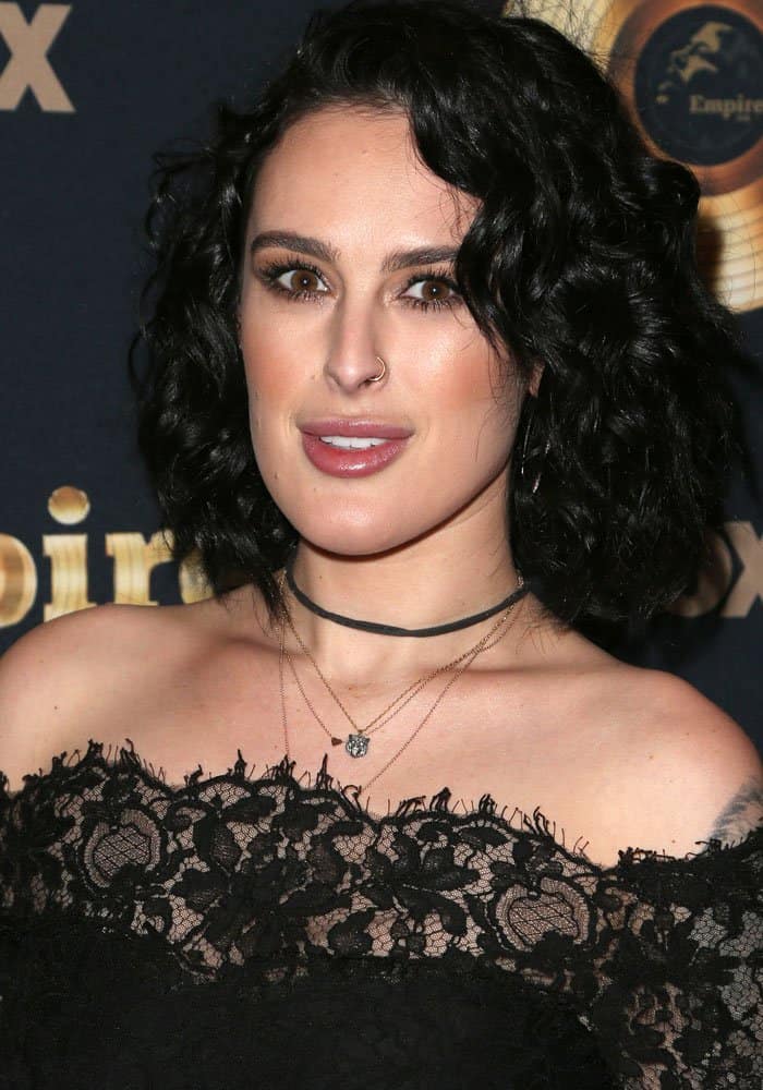 Rumer Willis stuns in an elegant off-the-shoulder black lace top, complemented by layered necklaces and her signature curly hairstyle at the Empire premiere