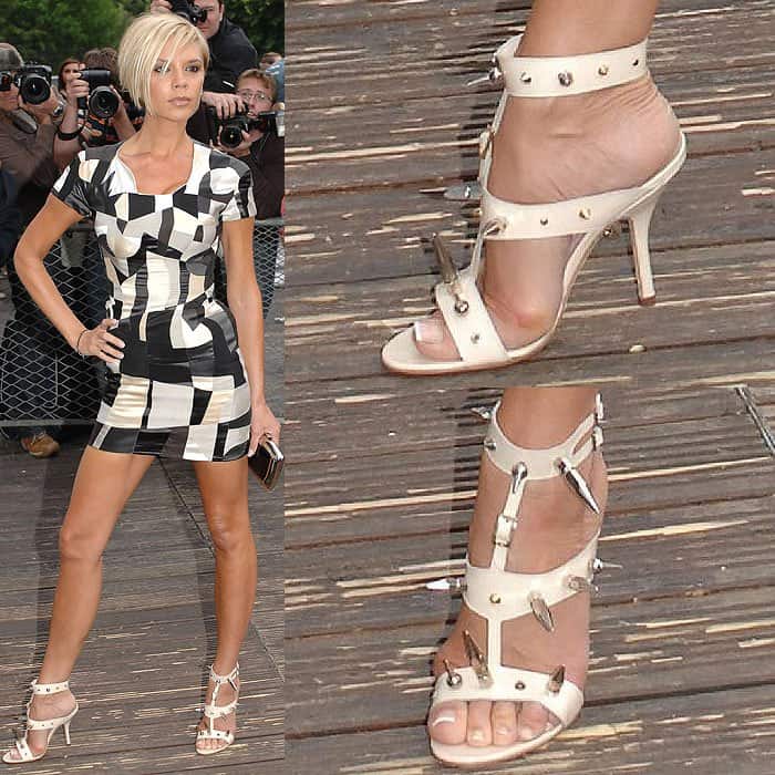 Victoria Beckham's bunions protruding from the straps of her spiked white t-strap sandals at the Graduate Fashion Week Gala Show and Awards held at Battersea Park Events Arena in London, England, on June 6, 2007.