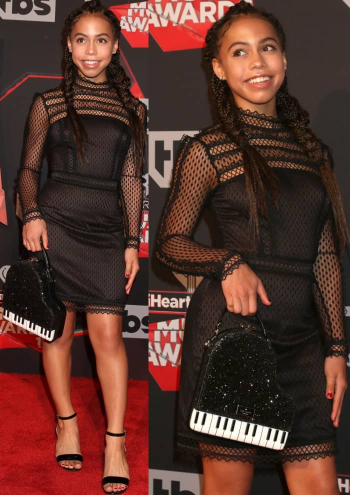 Asia Monet Ray wearing a black lace dress from Marciano at the 2017 iHeartRadio Music Awards