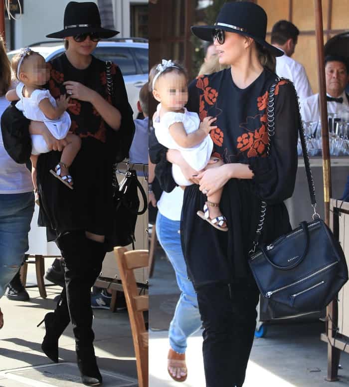Chrissy Teigen steps out in Beverly Hills with daughter Luna, pairing a chic embroidered mini dress with over-the-knee boots, a wide-brim hat, and a Givenchy shoulder bag on March 2, 2017