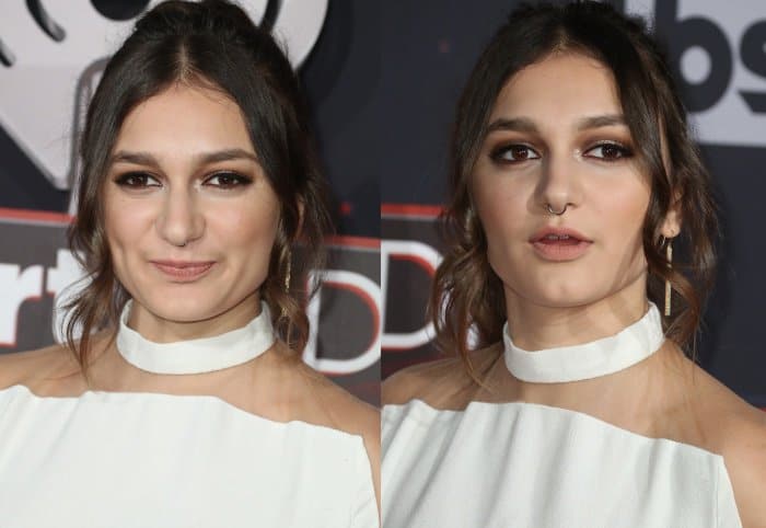 Daya wearing a white jumpsuit from Balmain and sparkly peep-toed heels with mesh panels at the 2017 iHeartRadio Music Awards