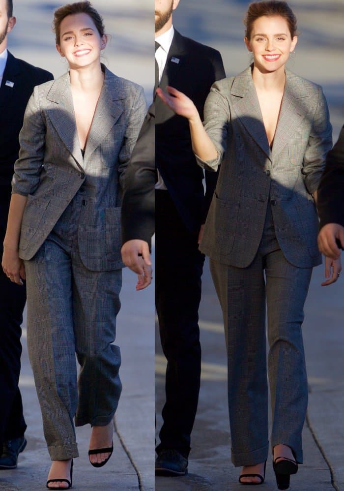 Emma Watson wearing a slouchy vintage suit from YSL and "Hey Simone" sandals from SUSI Studio
